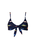 The Front Tie Top in Harbor by Kitty and Vibe features a navy blue, colorful fish print on a white background with adjustable shoulder straps and underbust elastic for support.