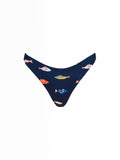 The Brief Bottoms in Harbor by Kitty and Vibe are navy blue bikini bottoms with a colorful fish pattern and medium coverage, shown on a plain white background.