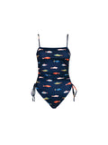 The Ruched Square Neck One Piece in Harbor by Kitty and Vibe is a navy blue swimsuit with colorful fish prints, a square neckline, adjustable shoulder straps, and ruched sides with adjustable drawstrings.