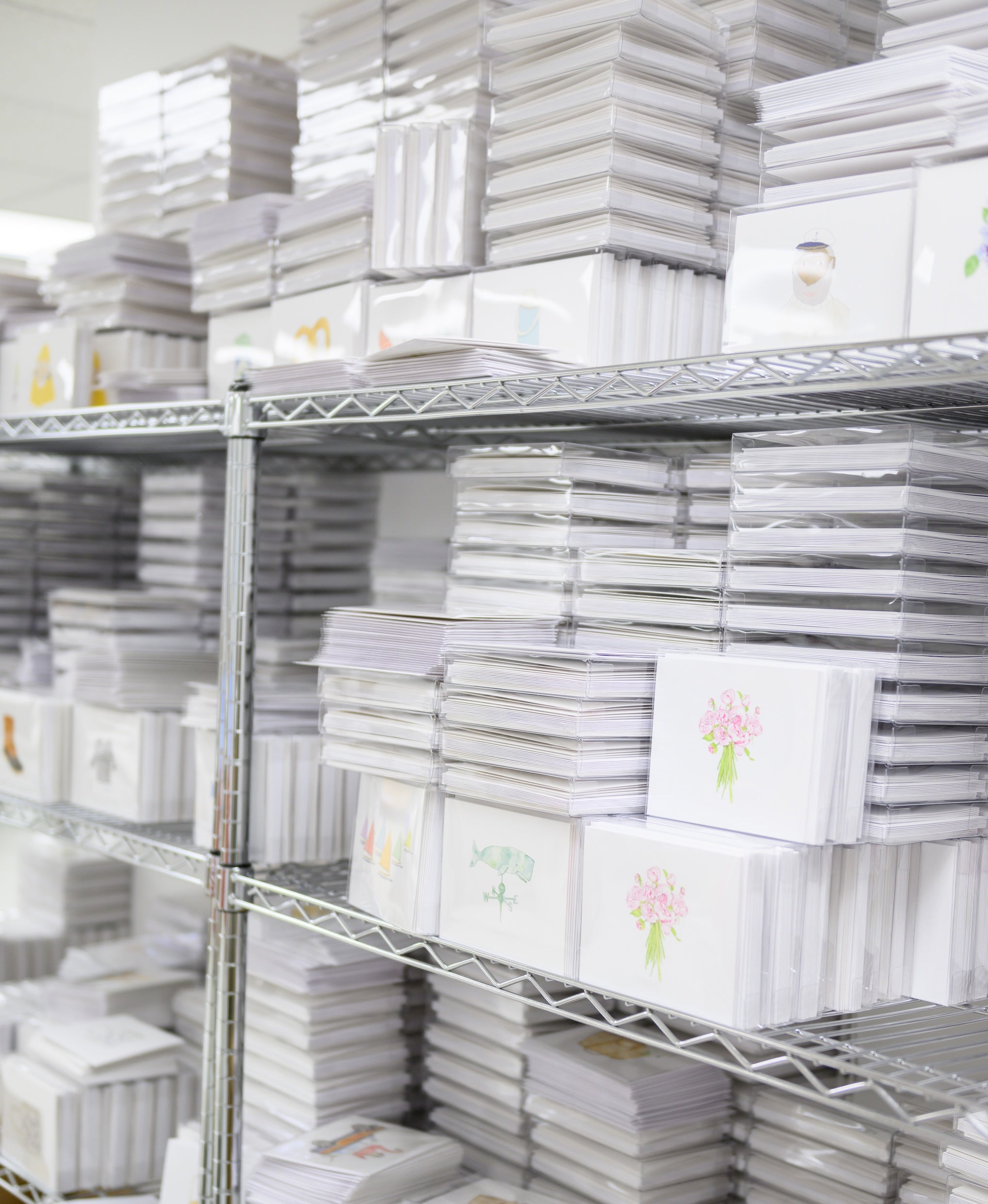 Stacks of Sara Fitz cards on wire racks