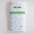 A folded light blue Anywhere Drying Mat, Happy Snowman, featuring a microfiber pattern of snowmen with earmuffs and scarves, held by a product label.