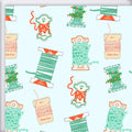 Holiday Trimmings Gift Wrap featuring a pattern of bakers twine, ribbon, pom-poms, and ric rac trim on a light blue eco-friendly paper background.