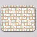 Large Holiday Stamps Tray, a rectangular melamine coated tray featuring a repeating pattern of holiday-themed postage stamps, including illustrations of Santa, whales, gingerbread houses, and wreaths.