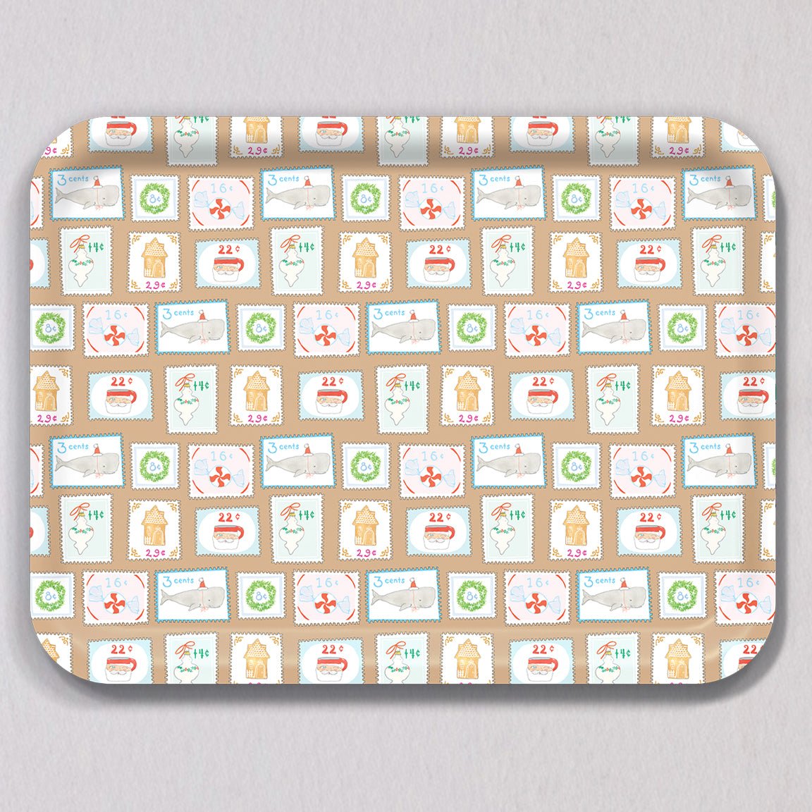 Large Holiday Stamps Tray, a rectangular melamine coated tray featuring a repeating pattern of holiday-themed postage stamps, including illustrations of Santa, whales, gingerbread houses, and wreaths.