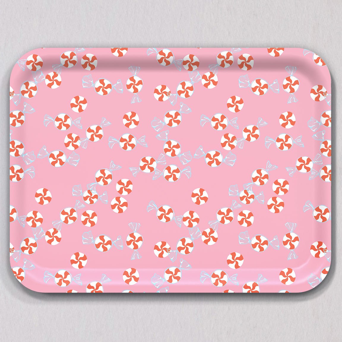 Large Peppermint Candies Tray featuring a rectangular melamine-coated birch wood surface with a pink background patterned with red and white peppermint candies.