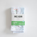 A folded Mighty Mini Towel, Happy Snowman, secured by a paper band labeled Once Again Home Co., showcasing the ultra-absorbent kitchen towel with a snowman print.