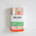 Stacked set of three small, patterned, ultra-absorbent Sara Fitz Mighty Mini Towel, Stockings featuring holiday stocking illustrations, secured with a product label.
