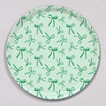 Large Green Bows Tray, Round, made of birch wood with a light green background featuring a repeating pattern of dark green bows.