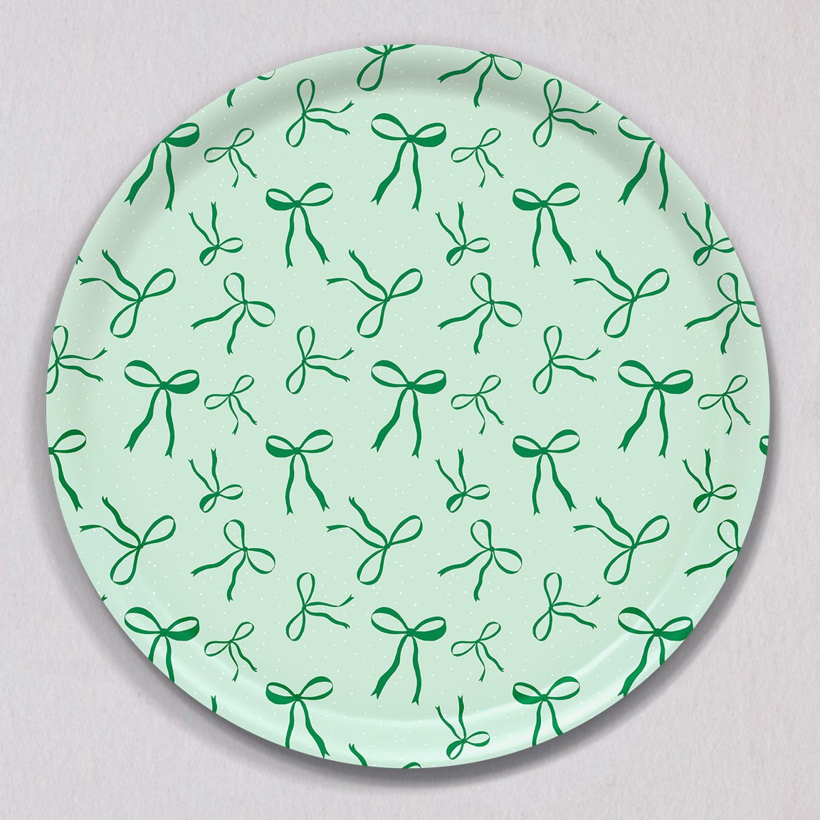 Large Green Bows Tray, Round, made of birch wood with a light green background featuring a repeating pattern of dark green bows.