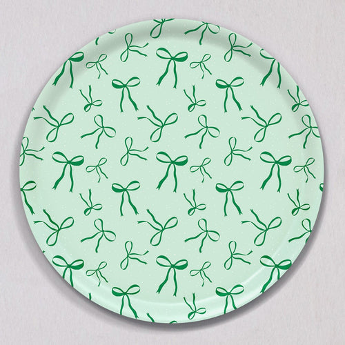 Large Green Bows Tray, Round, made of birch wood with a light green background featuring a repeating pattern of dark green bows.
