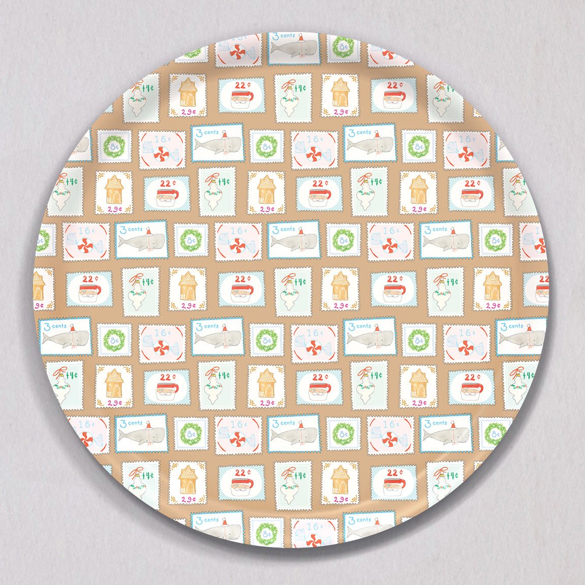 Large Holiday Stamps Tray, Round, featuring a repeating pattern of holiday-themed postage stamps with illustrations of whales, gingerbread houses, wreaths, and Santa Claus.