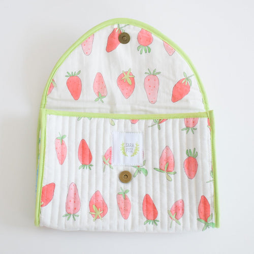 The Sara Fitz Clutch, Strawberry features quilted cotton with white fabric, red strawberries, green leaves, lime green trim, metal snap closures, and an interior label reading "SARA FITZ.