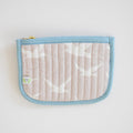 The Sara Fitz Coin Pouch, Seagull, features a beige fabric with a white bird pattern, light blue trim, a gold zipper at the top left corner, and a small green and white label. Inspired by handmade bag designs from India.