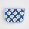 The Sara Fitz Coin Pouch, Shells features blue quilted cotton with a white scallop shell print, light purple trim, and a green-and-white label on the lower left. Handmade in India, it's shown on a white background.