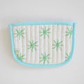 The Coin Pouch, Green Star by Sara Fitz is a cotton quilted pouch with a light blue border and zipper, white background with green starburst patterns, and a small side label. Made in India—ideal as a stylish card holder.