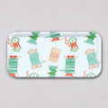 Small Holiday Trimmings Tray, a rectangular birch wood tray with a repeating pattern of vintage-style spools of ribbon, twine, and ricrac featuring holiday-themed illustrations.