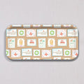Sara Fitz Small Holiday Stamps Tray: a rectangular, melamine-coated tray patterned with vintage-style holiday postage stamps featuring illustrations of whales, gingerbread houses, wreaths, and candy.