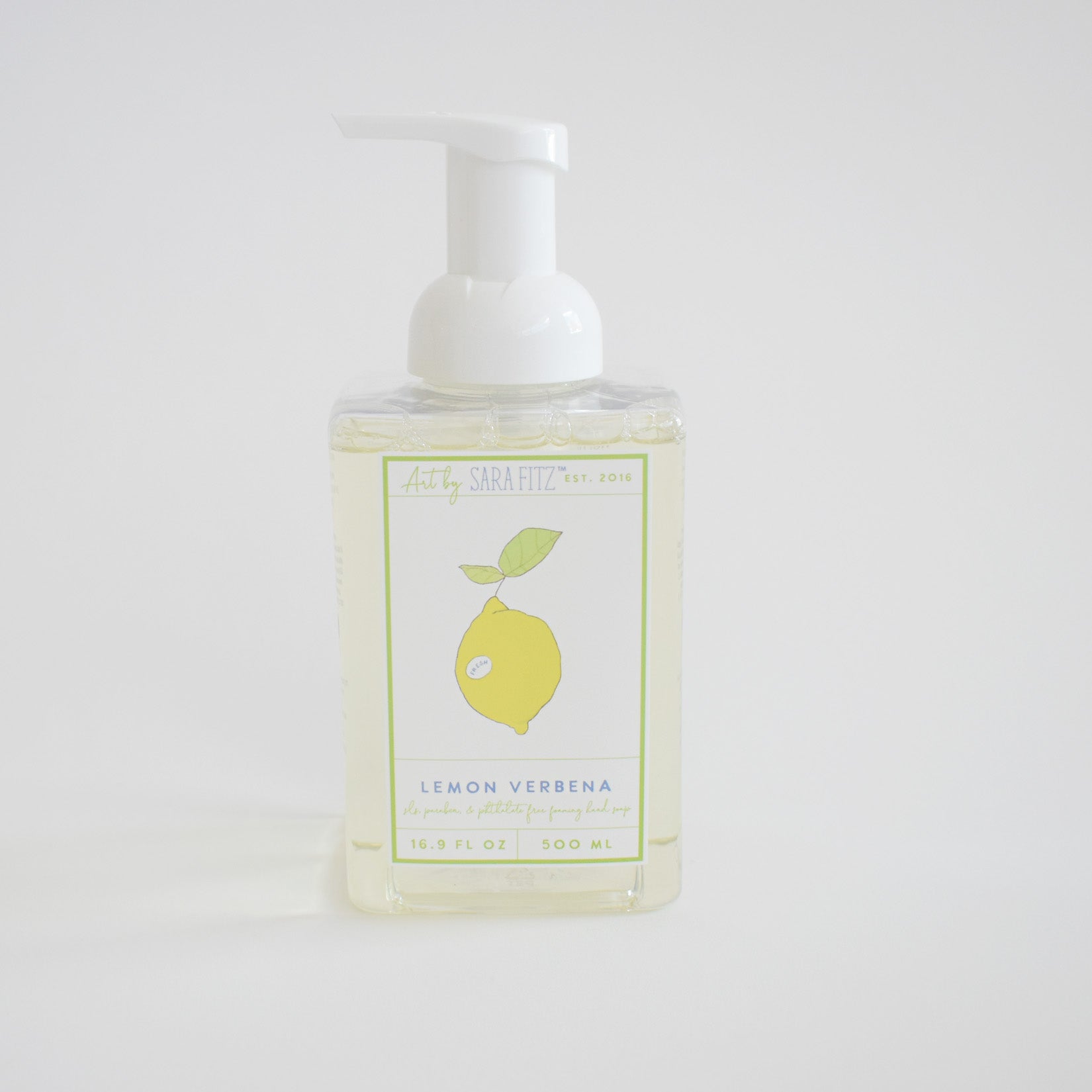 Sara Fitz Foaming Soap Lemon comes in a clear 500 ml (16.9 fl oz) pump bottle with a lemon and green leaves illustration, offering non-toxic, refreshing hand soap.