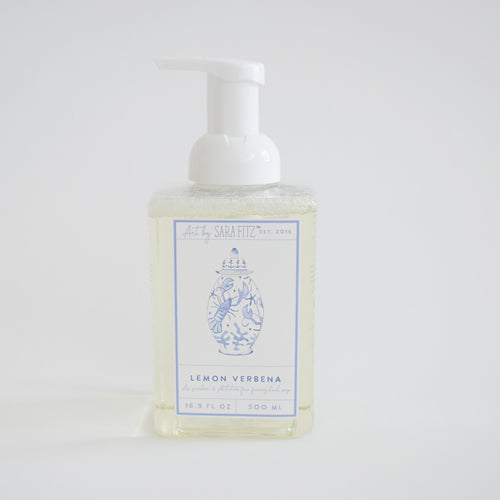 A clear pump bottle of Sara Fitz Foaming Soap Nautical Ginger Jar with a white pump top and a light blue label featuring floral designs, 16.9 fl oz / 500 ml, paraben free.