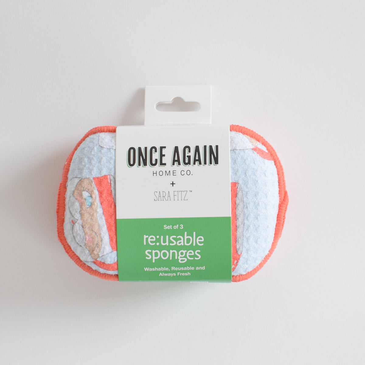 A set of three Re:usable Sponge, Santa Mug sponges held together by a paper label.