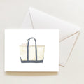 The Canvas Tote Note Card by Sara Fitz features a beige tote with dark handles, resting on a white envelope. Part of a USA-printed blank note card set, it’s perfect for any occasion.